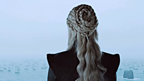 Woman with Braided Ponytail Looking Over Water