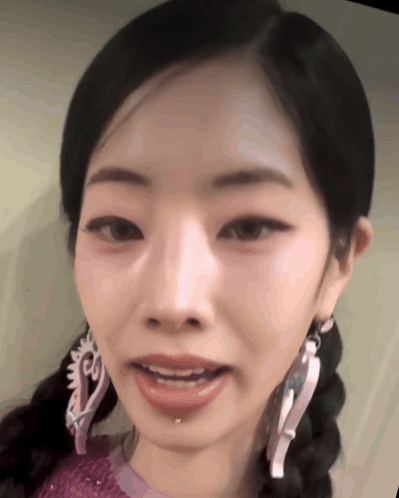 Woman with Braids and Earrings