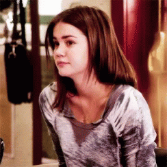Woman with Brown Hair Wearing Gray Sweater