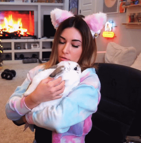 Woman With Cat Ears Holding White Rabbit