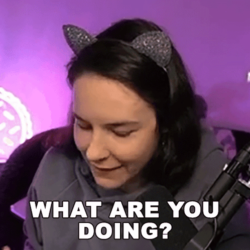 Woman with Cat Ears Sitting at Microphone