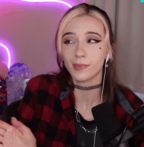 Woman With Choker and Ear Buds Looking Sideways