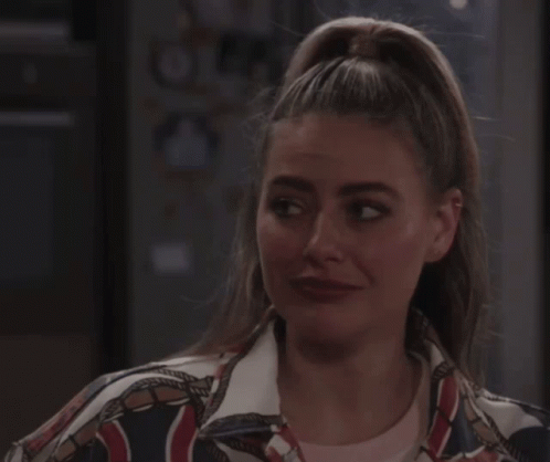 Woman With Closed Eyes In NY Jacket GIF
