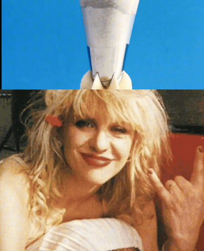 Woman With Cone And Rocket On Head GIF