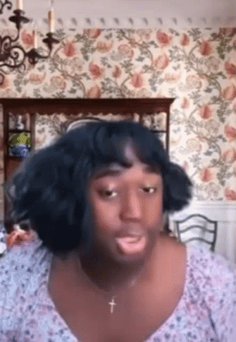 Woman with Cross Necklace and Wig Making Funny Face