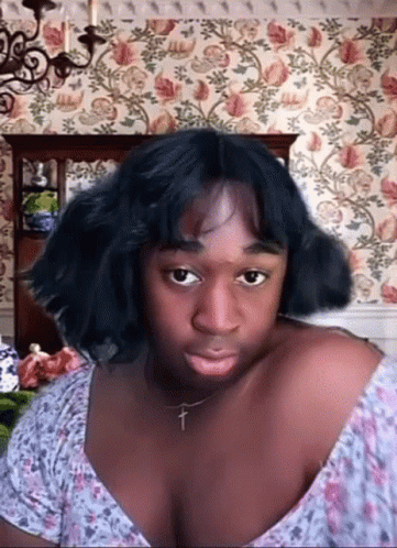 Woman With Cross Necklace Making Funny Face