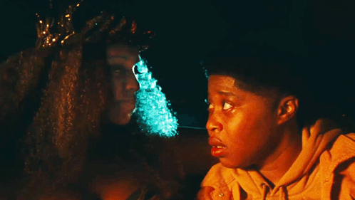 Woman With Crown Sits Next To Boy GIF