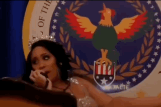 Woman with Crown Sitting in Front of Seal with Rooster