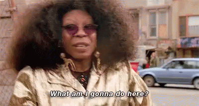 Woman With Curly Hair and Sunglasses Talking