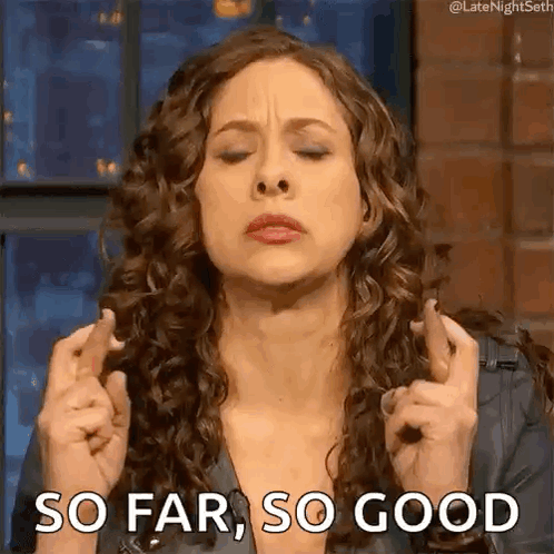 Woman with Curly Hair Crossing Fingers