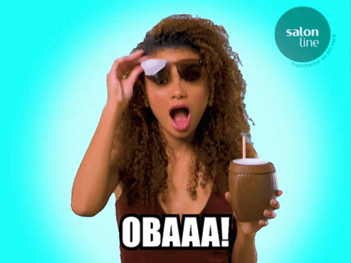 Woman with Curly Hair Holding Coconut Drink O Baaa