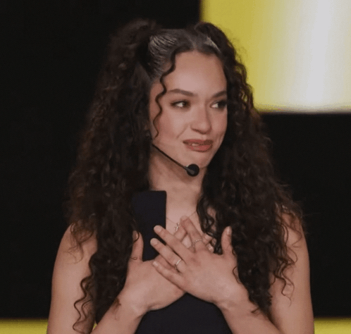Woman With Curly Hair Holding Microphone