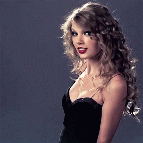 Woman With Curly Hair In Black Dress GIF