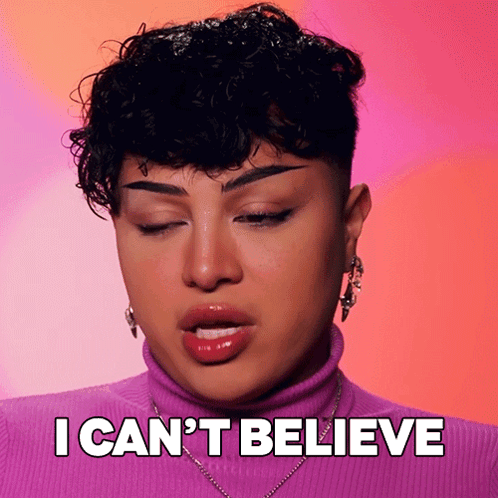Woman With Curly Hair In Purple Turtleneck GIF