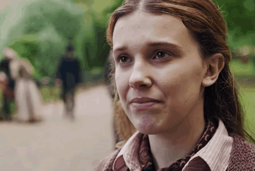 Woman With Curly Hair Looking at Man
