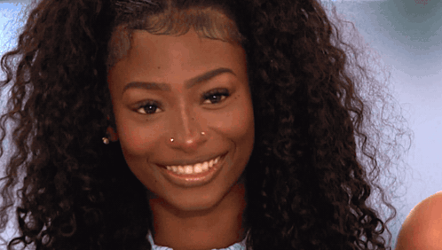 Woman With Curly Hair Smiling And Nose Ring GIF
