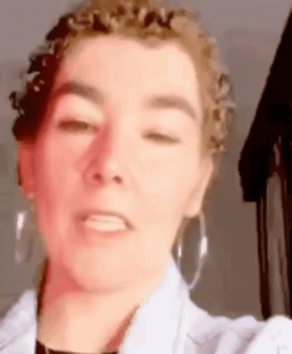 Woman with Curly Hair Taking Selfie
