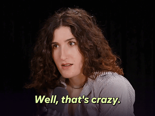 Woman With Curly Hair Talking Into Microphone Says Well That's Crazy GIF