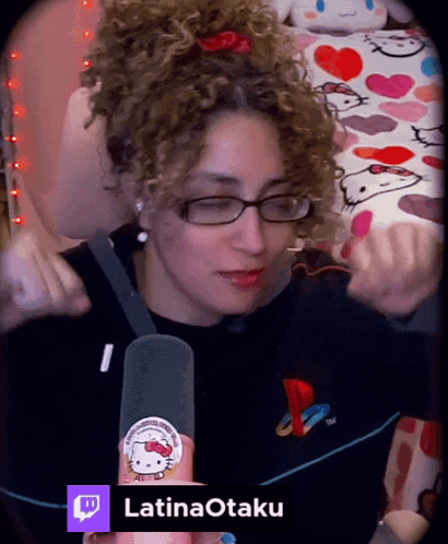 Woman With Curly Hair Wearing Glasses and Hello Kitty Sticker