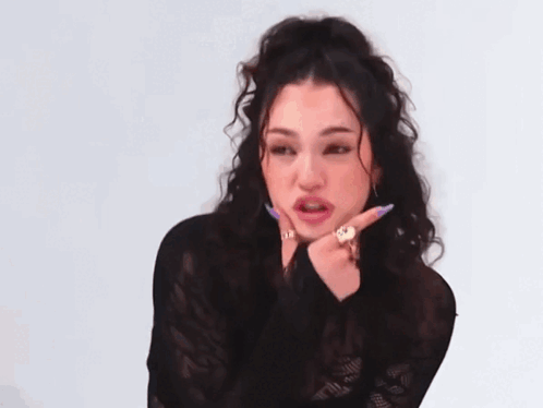 Woman with Curly Hair Wearing Lace Top