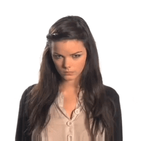 Woman With Dark Hair, Black Cardigan, Beige Shirt