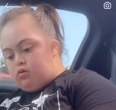 Woman with Down Syndrome Looking Out Car Window