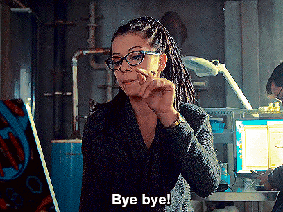 Woman With Dreadlocks and Glasses Saying Bye Bye