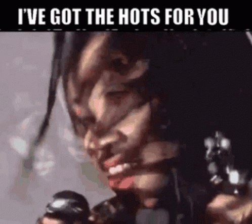 Woman With Dreadlocks Holding Gun Says I've Got the Hots for You
