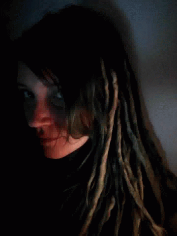 Woman with Dreadlocks Lying Down
