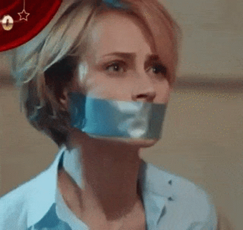 Woman With Duct Tape On Mouth Looking Up