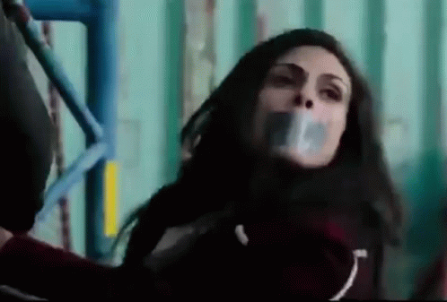 Woman With Duct Tape On Mouth On Scaffolding GIF