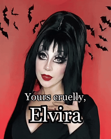 Woman With Elvira Makeup And Hair GIF