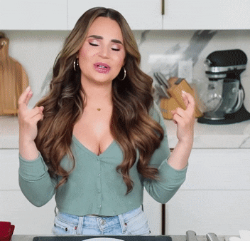 Woman With Eyes Closed and Crossed Hands