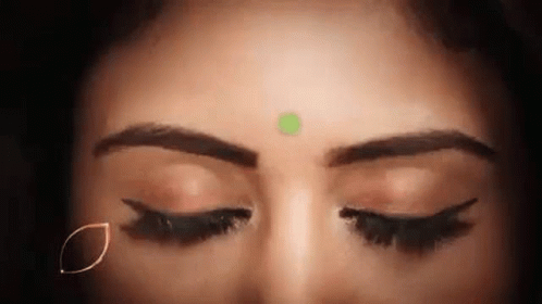 Woman With Eyes Closed and Green Bindi