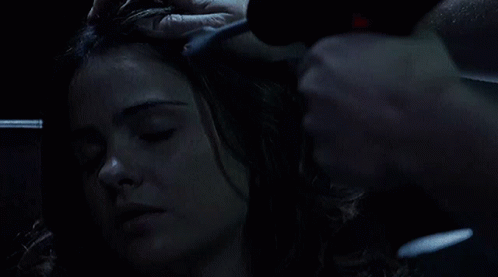 Woman With Eyes Closed Being Brushed