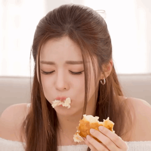 Woman With Eyes Closed Eating Bread