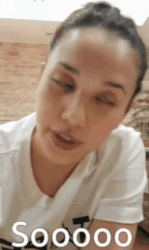 Woman With Eyes Closed In White Shirt Saying Soooo GIF