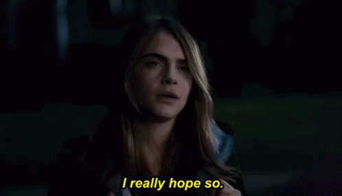 Woman With Eyes Closed Saying I Really Hope So GIF