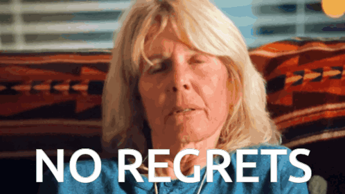 Woman With Eyes Closed Saying No Regrets GIF