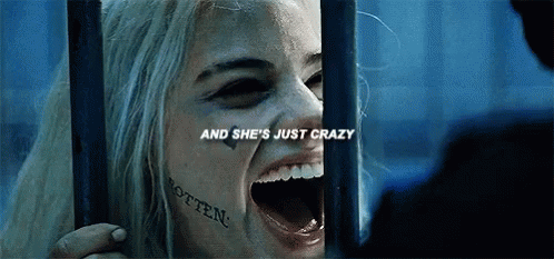 Woman With Face Tattoo Behind Bars GIF