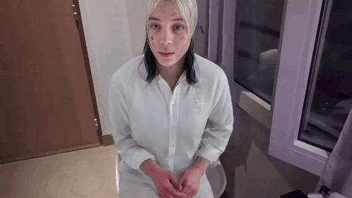 Woman With Face Tattoo Sitting On Toilet GIF