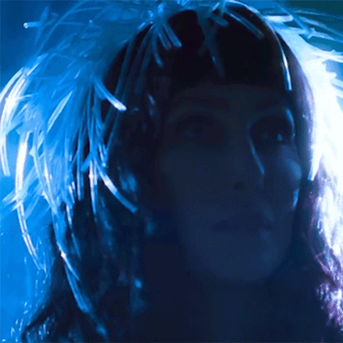 Woman With Feathers in Hair