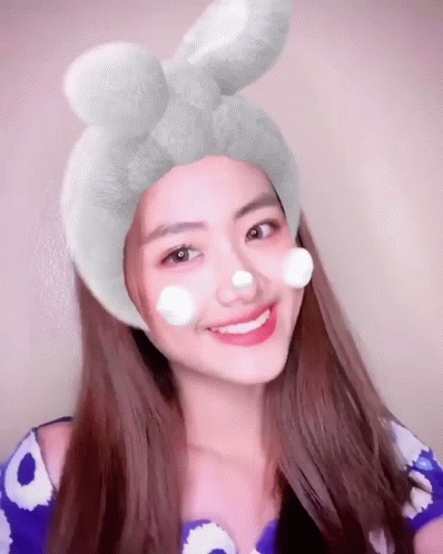 Woman With Flower Crown Holding Red Apple GIF