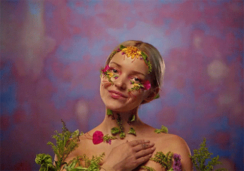 Woman With Flower Face Paint GIF