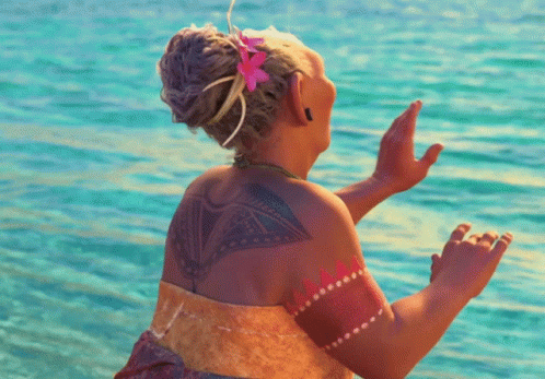Woman With Flower in Hair and Tattoo on Back