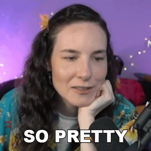 Woman With Flower in Hair at Microphone Saying So Pretty