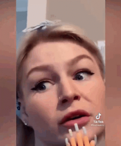 Woman With Fork In Mouth GIF