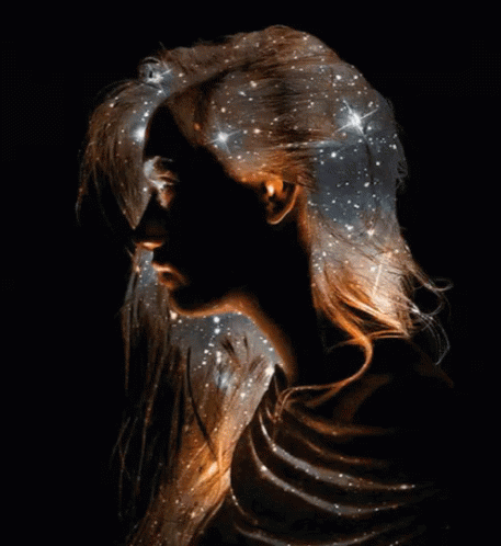 Woman With Galaxy Projected On Hair GIF