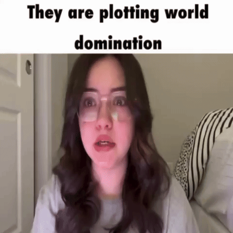 Woman With Glasses And Bandage Plotting World Domination GIF