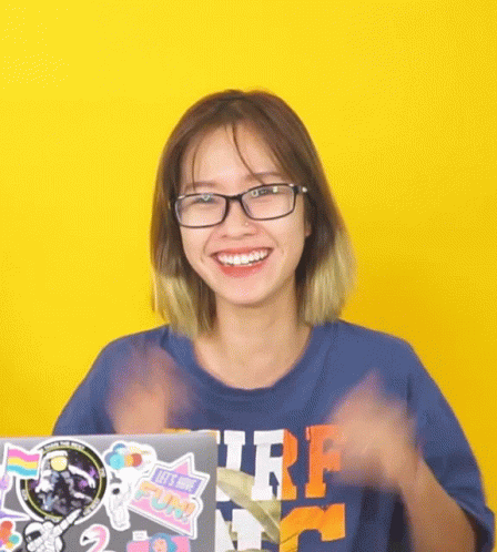 Woman with Glasses and Blue Surf Shirt Smiling